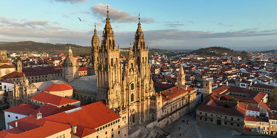 An aerial view of Santiago de Compostela, the ornate cathedral towers above the city. 